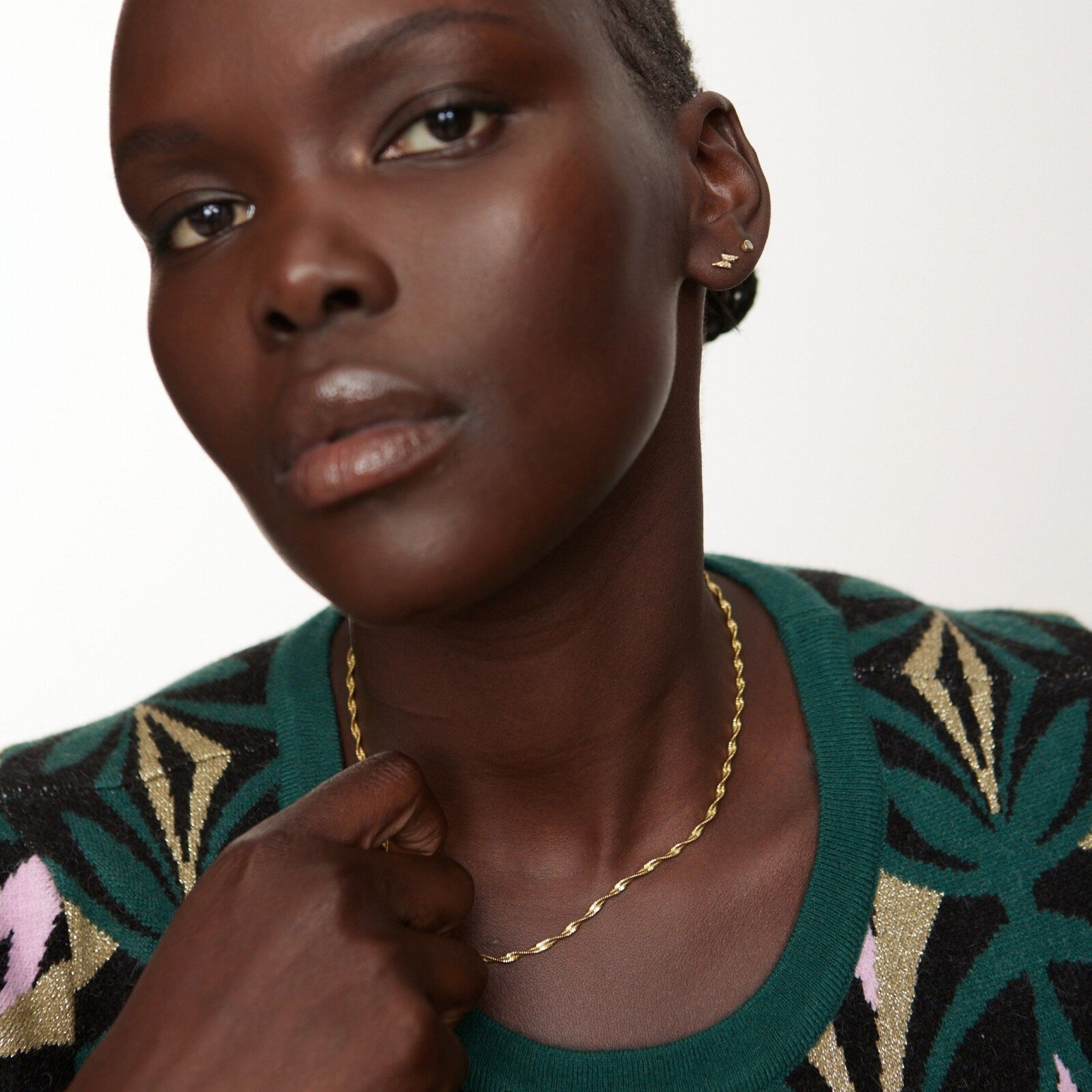 Model wearing a gold plated rope chain necklace 